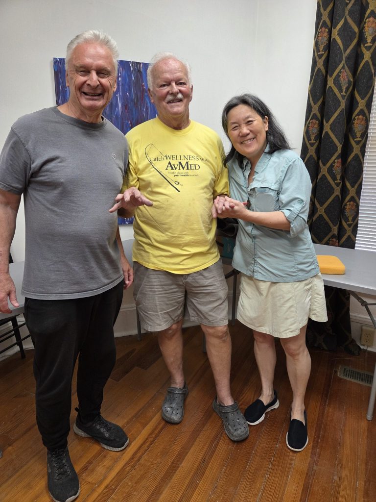Jeffery Geller, Jim Tripp and Irina Shin-Geller after successfully firing the new kiln at the Robeson Art Guild